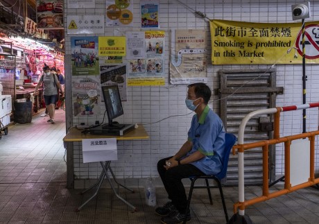 In wet markets like this, swimming pools, parks and on the streets in Hong Kong is an army of underemployed and elderly cleaners and sweepers. They are the victims of colonial officials’ opposition to free compulsory education, which left those from poor families semi-literate at best. Photo: Vernon Yuen/NurPhoto via Getty Images