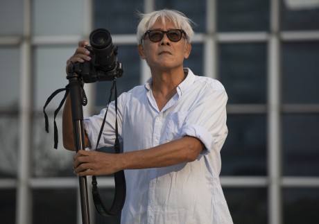 Hong Kong photographer John Fung at the IFC in Central, Hong Kong. He says living in the present is what informs his art. Photo: Antony Dickson