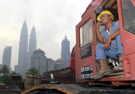 A construction worker takes a smoke break in Kuala Lumpur. File photo: AFP 