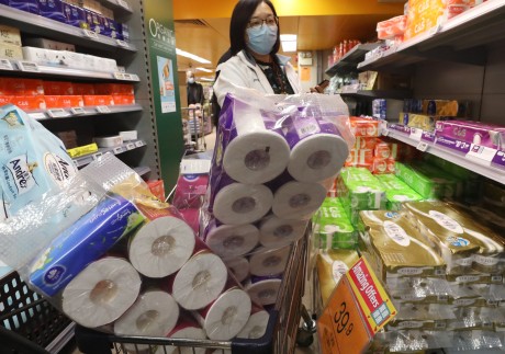 One shoppers gets her fill of toilet paper at a supermarket in Wan Chai. Photo: Nora Tam
