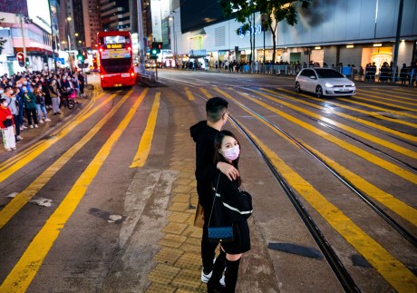 People wait to cross the road in Hong Kong on December 20. We need to redouble our efforts to create a more liveable and affordable city with a higher quality of life for all. Photo: Zuma wire/dpa