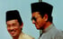 Anwar Ibrahim and Mahathir Mohamad, at the time Malaysia’s deputy prime minister and premier respectively, during a party meeting in 1998. Photo: AP