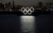 A giant Olympic rings monument at dusk in Odaiba Marine Park, Tokyo. Photo: EPA