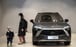 A child eyes up a NIO ES8 electric vehicle at a NIO House in Shanghai. Photo: Bloomberg