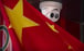 A Chinese flag hangs near a security camera outside of a shop in Beijing on October 8, 2019. The United States blacklisted a group of Chinese tech companies that develop facial recognition and other artificial intelligence technology that the US says is being used to repress China’s Muslim minority groups. Photo: AP 