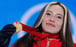 Eileen Gu holds up her gold medal during the women’s freeski halfpipe victory ceremony at the Beijing 2022 Winter Olympics in Zhangjiakou on February 18. Photo: AFP