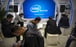 Attendees look at their smartphones at a booth from chip maker Intel at the PT Expo in Beijing on October 31, 2019. Photo: AP