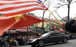 The US and Vietnamese flags are waved in Hanoi as a motorcade transports North Korean leader Kim Jong-un to a summit with President Donald Trump. Photo: AP