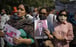 A woman holds a photograph of Chinese President Xi Jinping as Indian demonstrators gather for a protest near the Chinese embassy in New Delhi on Tuesday to mark the anniversary of the 1962 war between the two countries. Photo: AP
