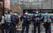 Police officers stand guard in Central during a lunchtime rally on February 21. In one case that was successfully prosecuted under the Personal Data (Privacy) Ordinance, the personal data of a family member of a police officer was disclosed to a group on social media for doxxing. Photo: Xiaomei Chen