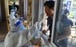 A resident gets tested in Nanjing on Monday as the country grapples with its most widespread outbreak in months. Photo: AFP