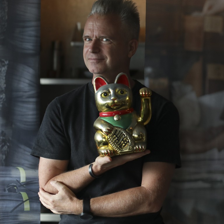 His viral cat photos snapped in Hong Kong shops saw him take the 