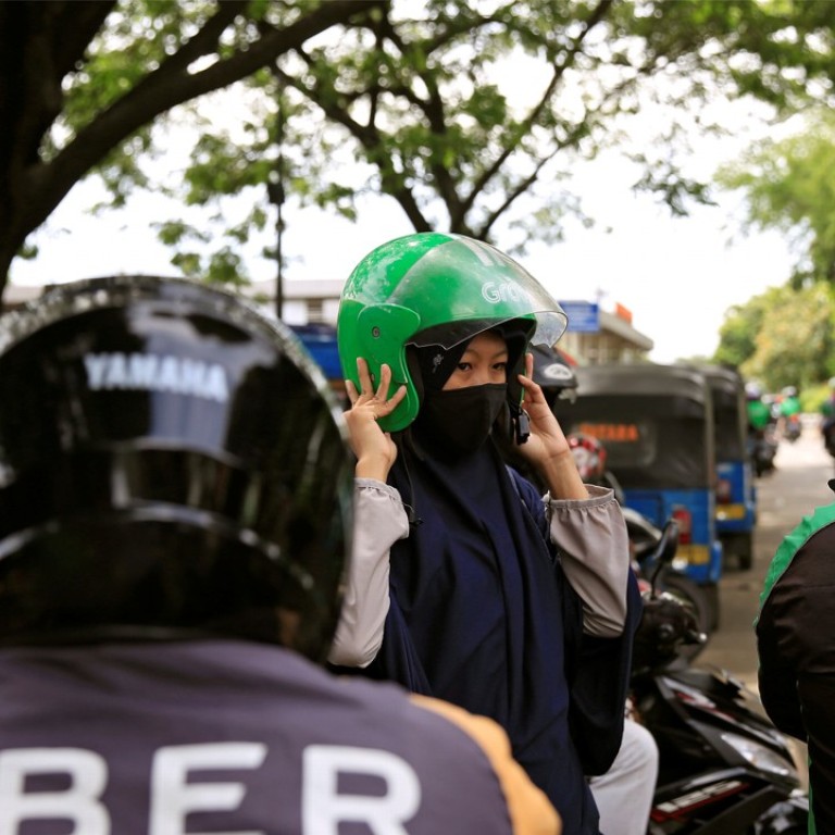 Grab vanquishes Uber with local strategy, billions from SoftBank 