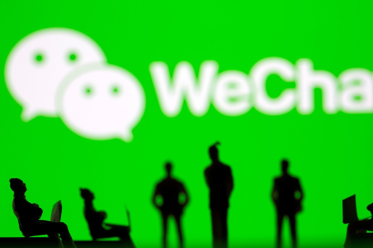 Small toy figures are seen in front of WeChat logo in this illustration pic...